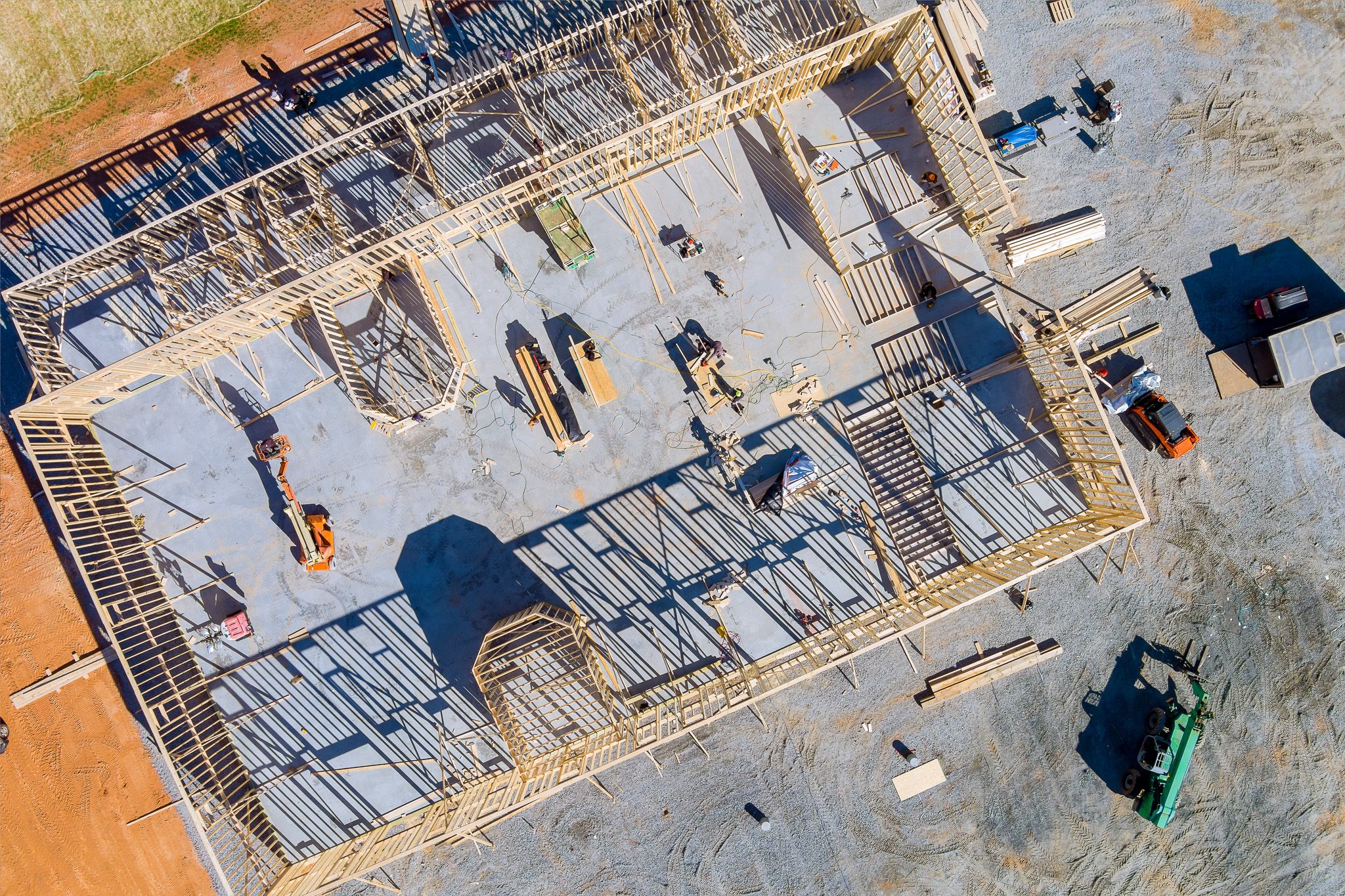 Top aerial view new framing stick built building of beams on new home under construction